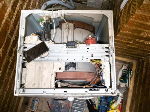 top view of repairing an old washing machine at home